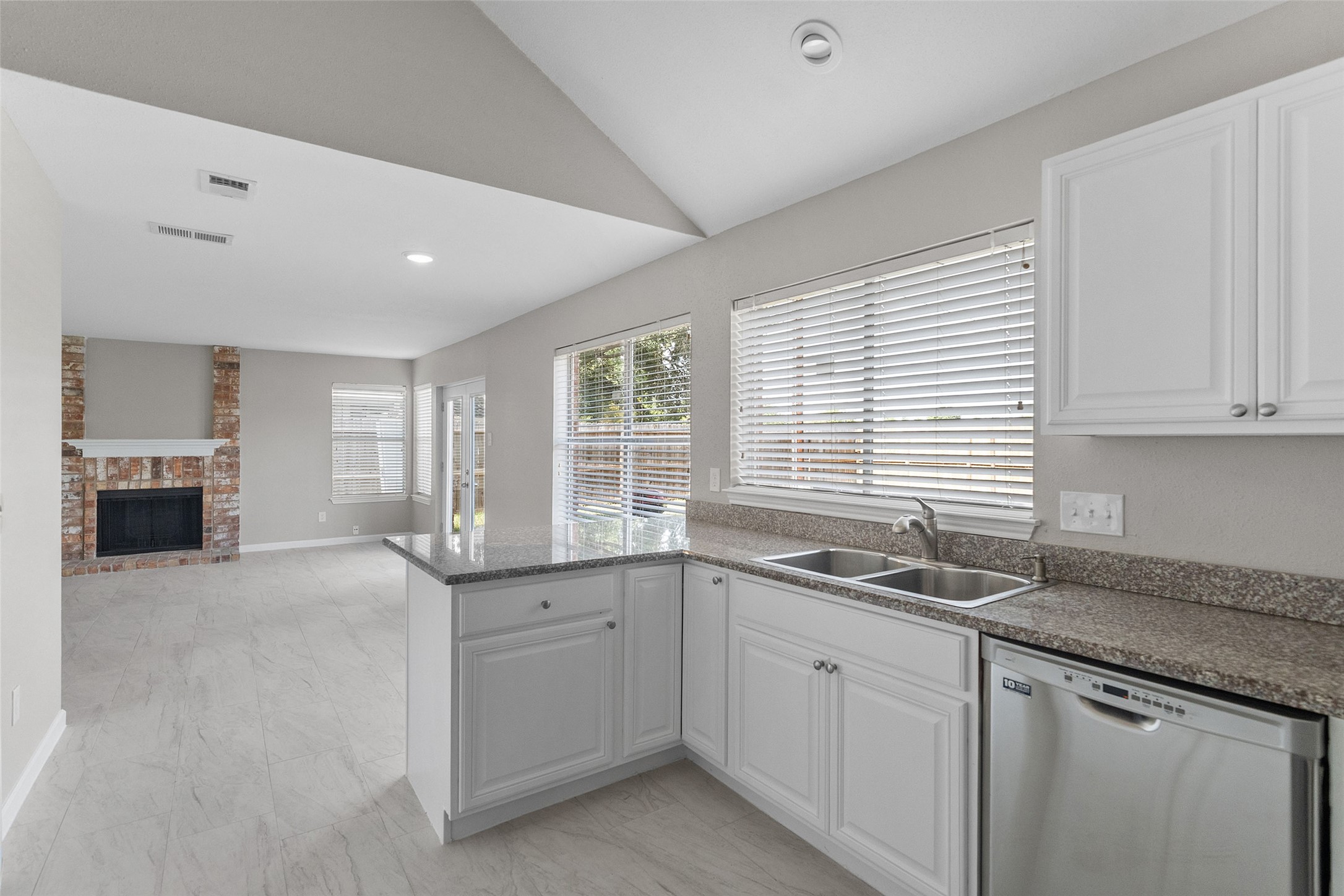 10402 Trading Post Drive Houston, TX 77064 - Photo 9 of 43 a kitchen that has a sink and cabinets