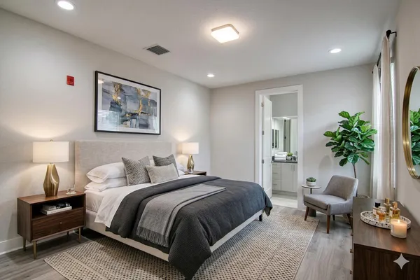 a spacious bedroom with a bed and a couch