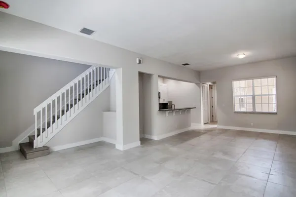 a view of an empty room with a window