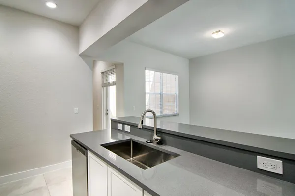a kitchen with a sink and cabinets