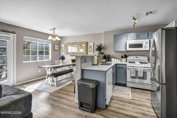 a kitchen with a sink stove and refrigerator
