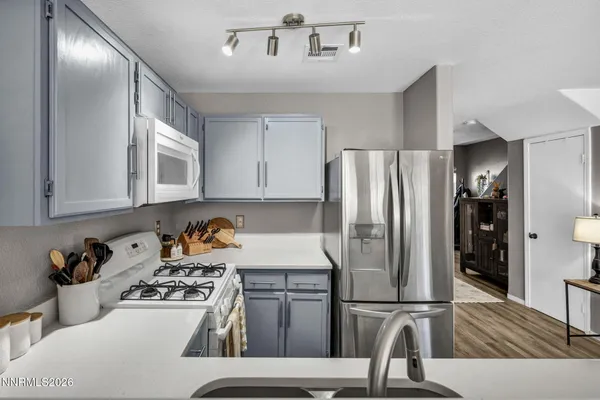 a kitchen with a stove and cabinets