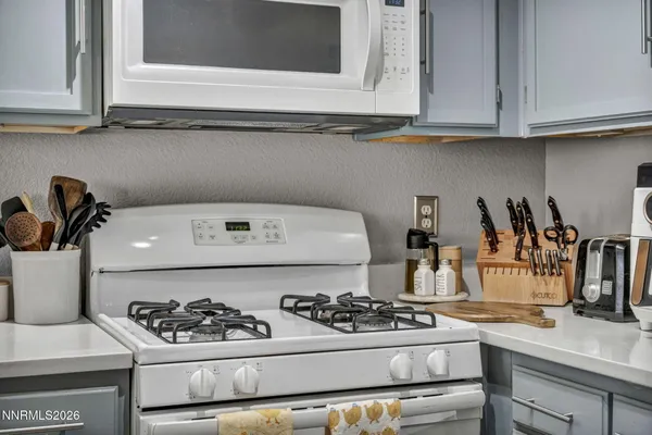 a utility room with sink dryer and washer