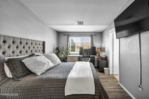 a bed room with a bed and a book shelf