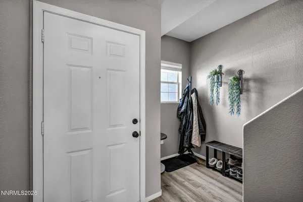 a view of a entryway with wooden floor