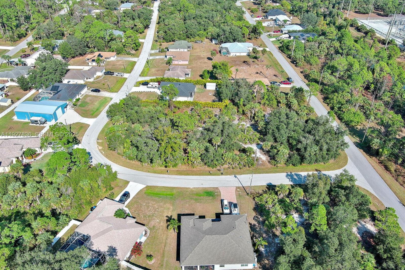 0 Santa Ana Road North Port, FL 34286 - Photo 12 of 21 an aerial view of residential house with outdoor space and trees all around