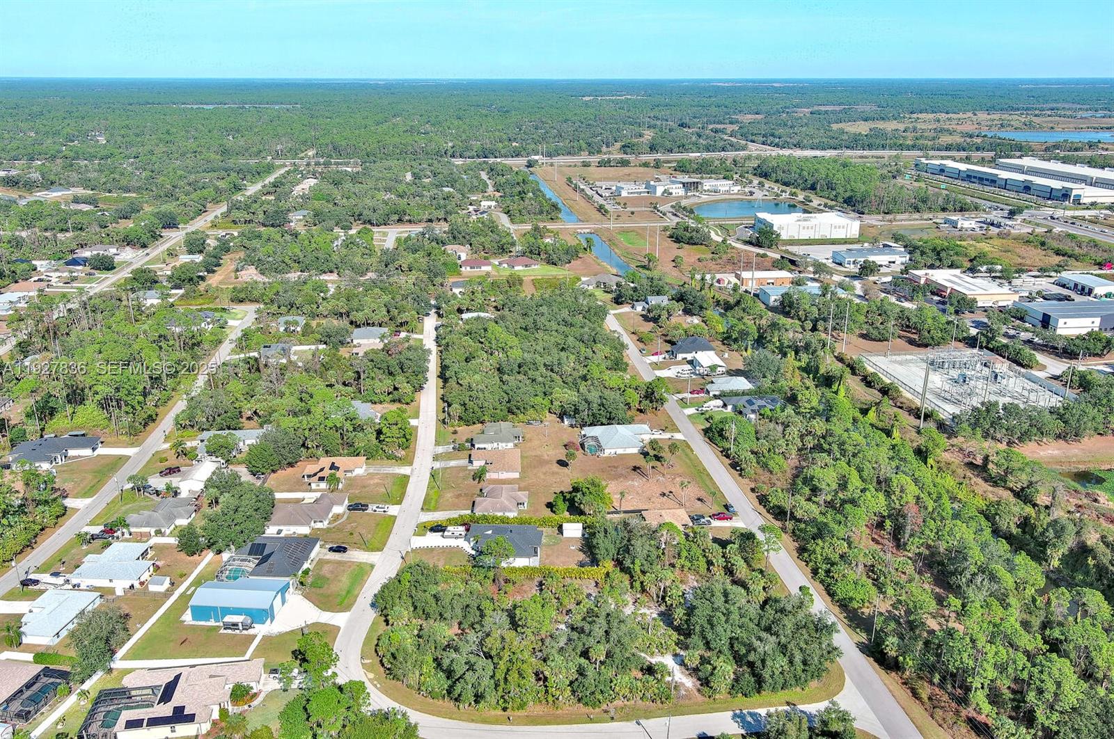 0 Santa Ana Road North Port, FL 34286 - Photo 16 of 21 an aerial view of residential houses with outdoor space and trees