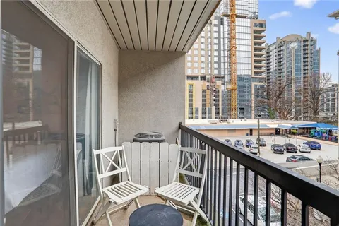 a view of balcony with furniture
