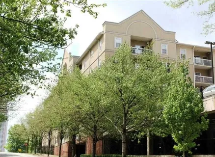 a front view of a house with trees