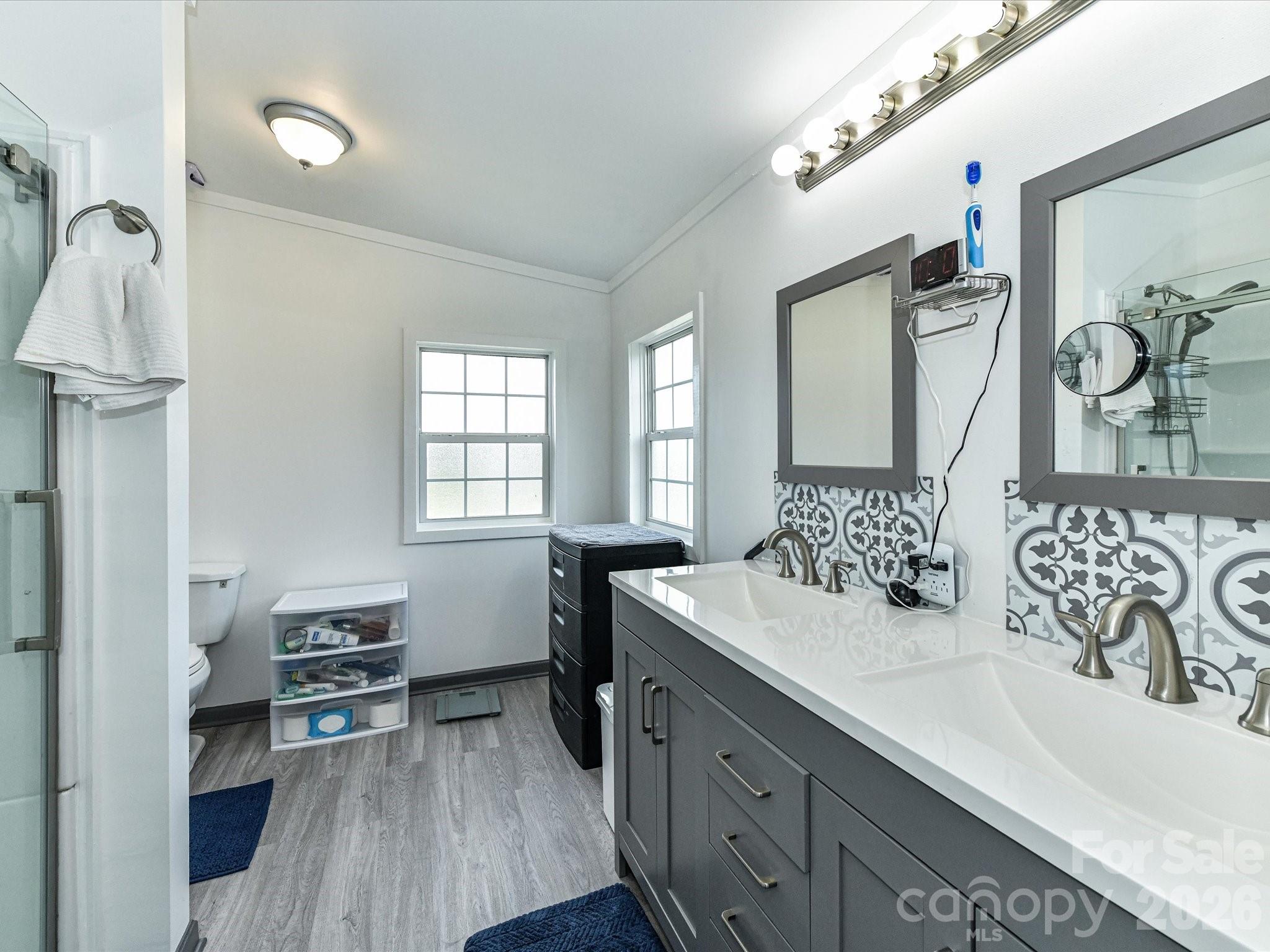1565 Foxbrook Circle Lancaster, SC 29720 - Photo 16 of 28 a en suite bathroom with a double vanity sink and a mirror