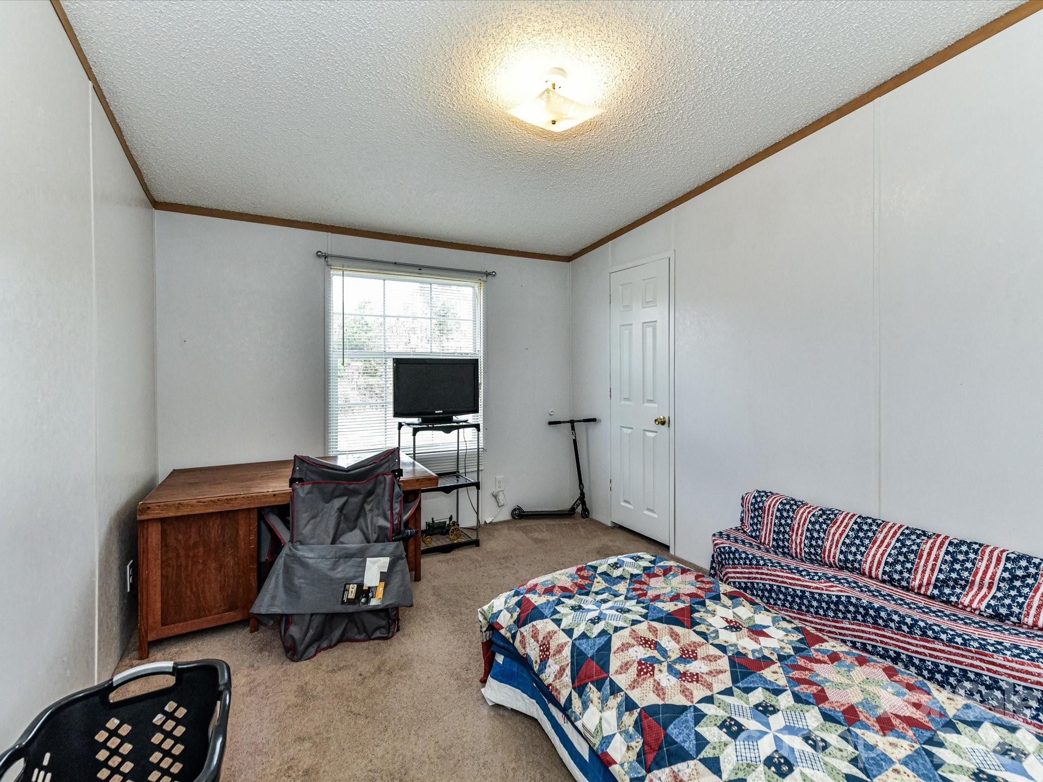 1565 Foxbrook Circle Lancaster, SC 29720 - Photo 19 of 28 a bedroom with furniture and a window