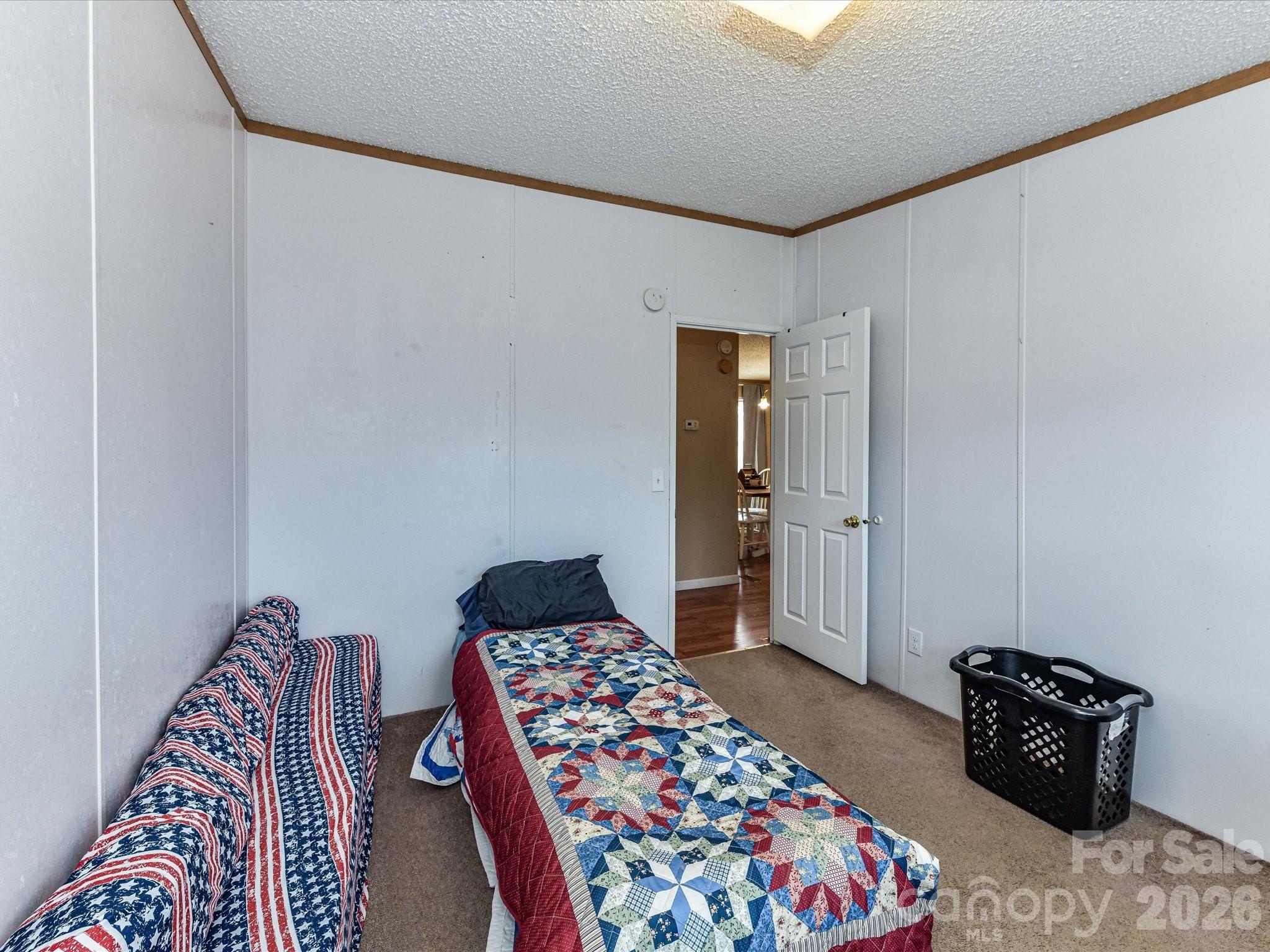 1565 Foxbrook Circle Lancaster, SC 29720 - Photo 20 of 28 a bedroom with a bed and a chair