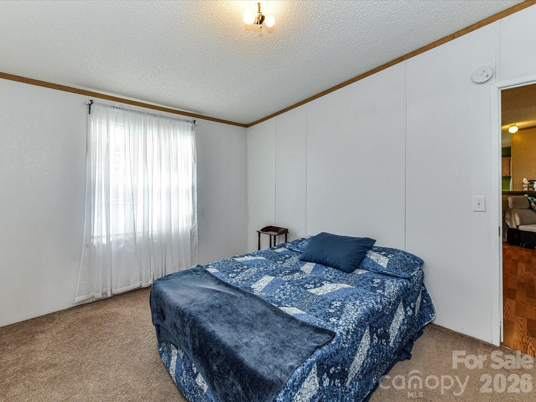 1565 Foxbrook Circle Lancaster, SC 29720 - Photo 23 of 28 a bedroom with a bed and window
