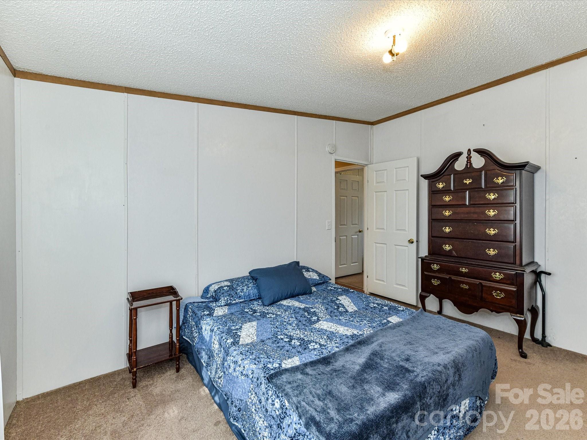 1565 Foxbrook Circle Lancaster, SC 29720 - Photo 24 of 28 a bedroom with a bed and dresser