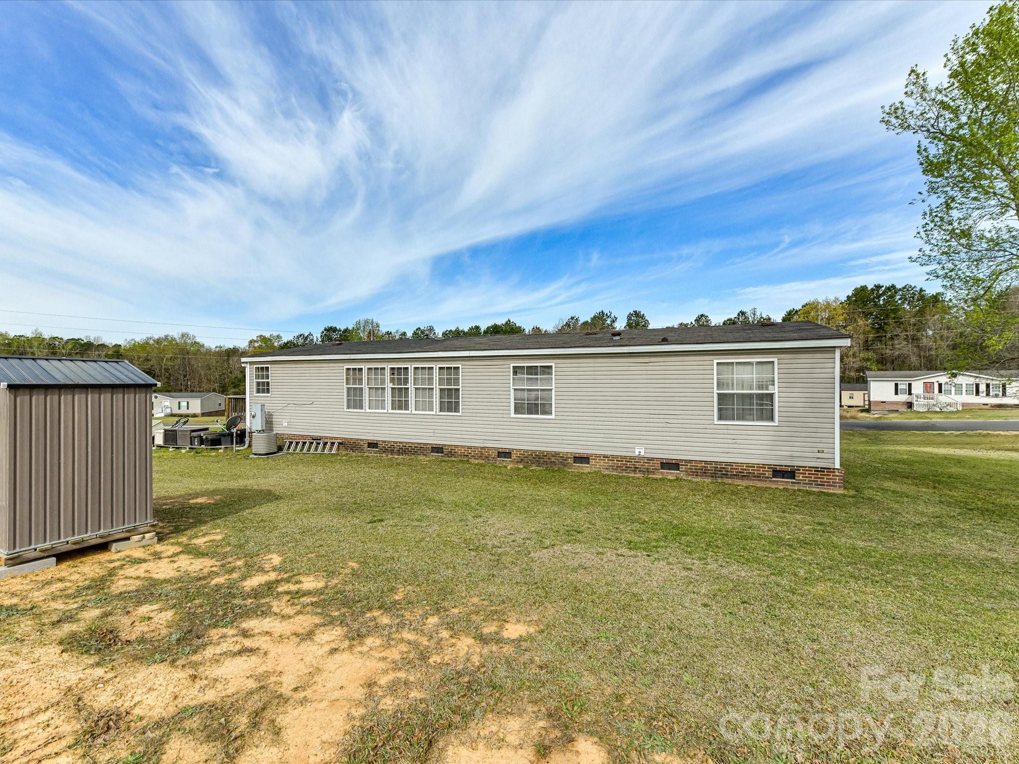 1565 Foxbrook Circle Lancaster, SC 29720 - Photo 28 of 28 a view of a yard in front of a house with a large tree