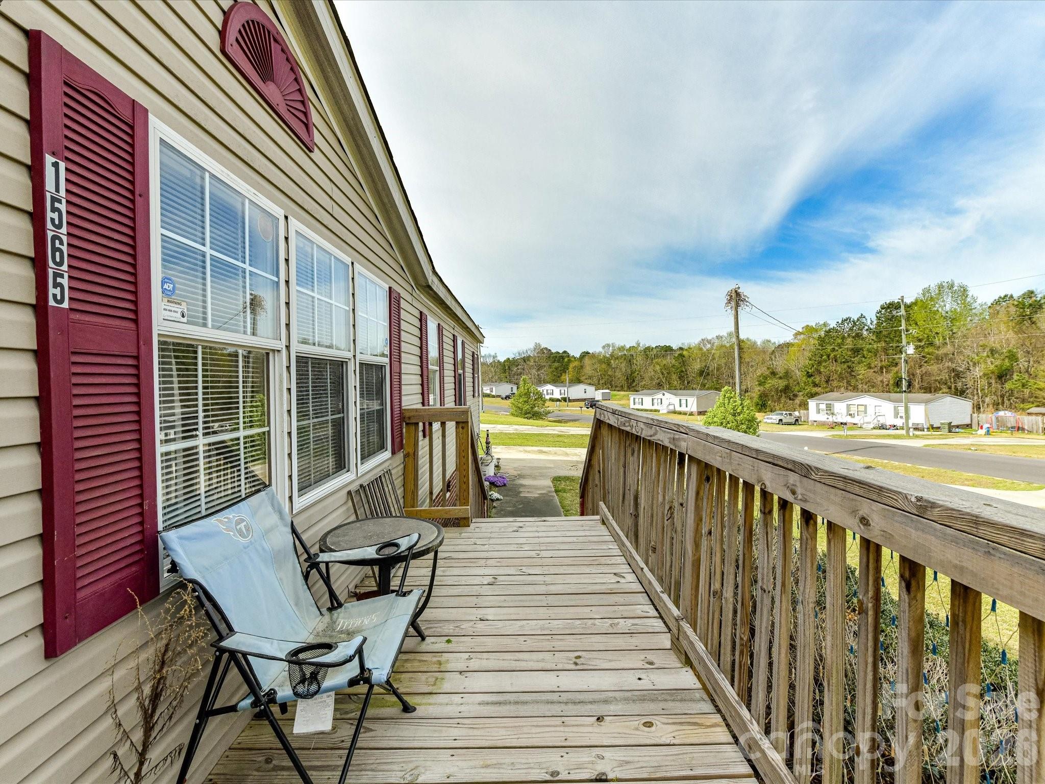 1565 Foxbrook Circle Lancaster, SC 29720 - Photo 5 of 28 a view of a balcony with wooden floor and outdoor seating