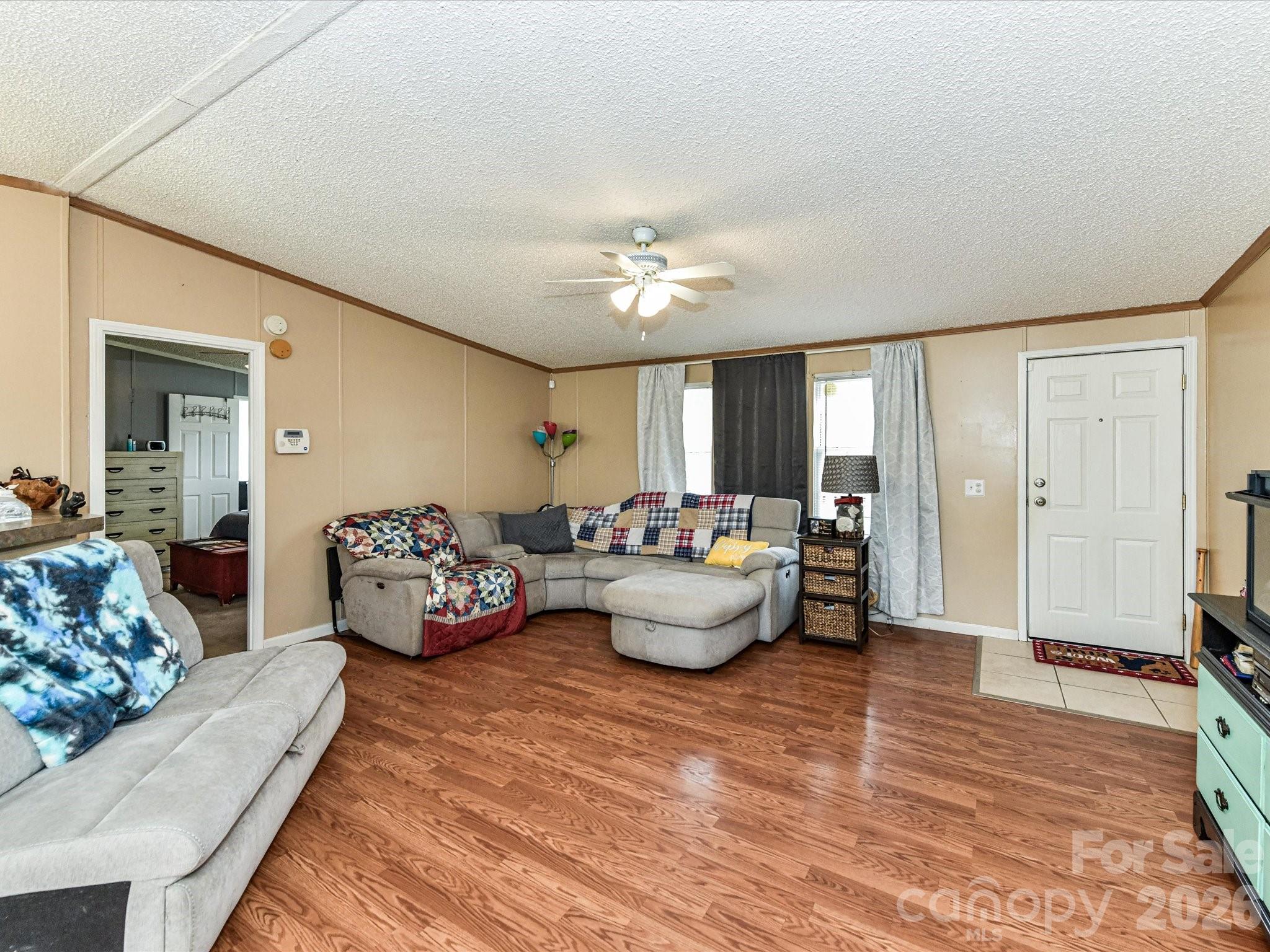 1565 Foxbrook Circle Lancaster, SC 29720 - Photo 7 of 28 a living room with furniture and a chandelier