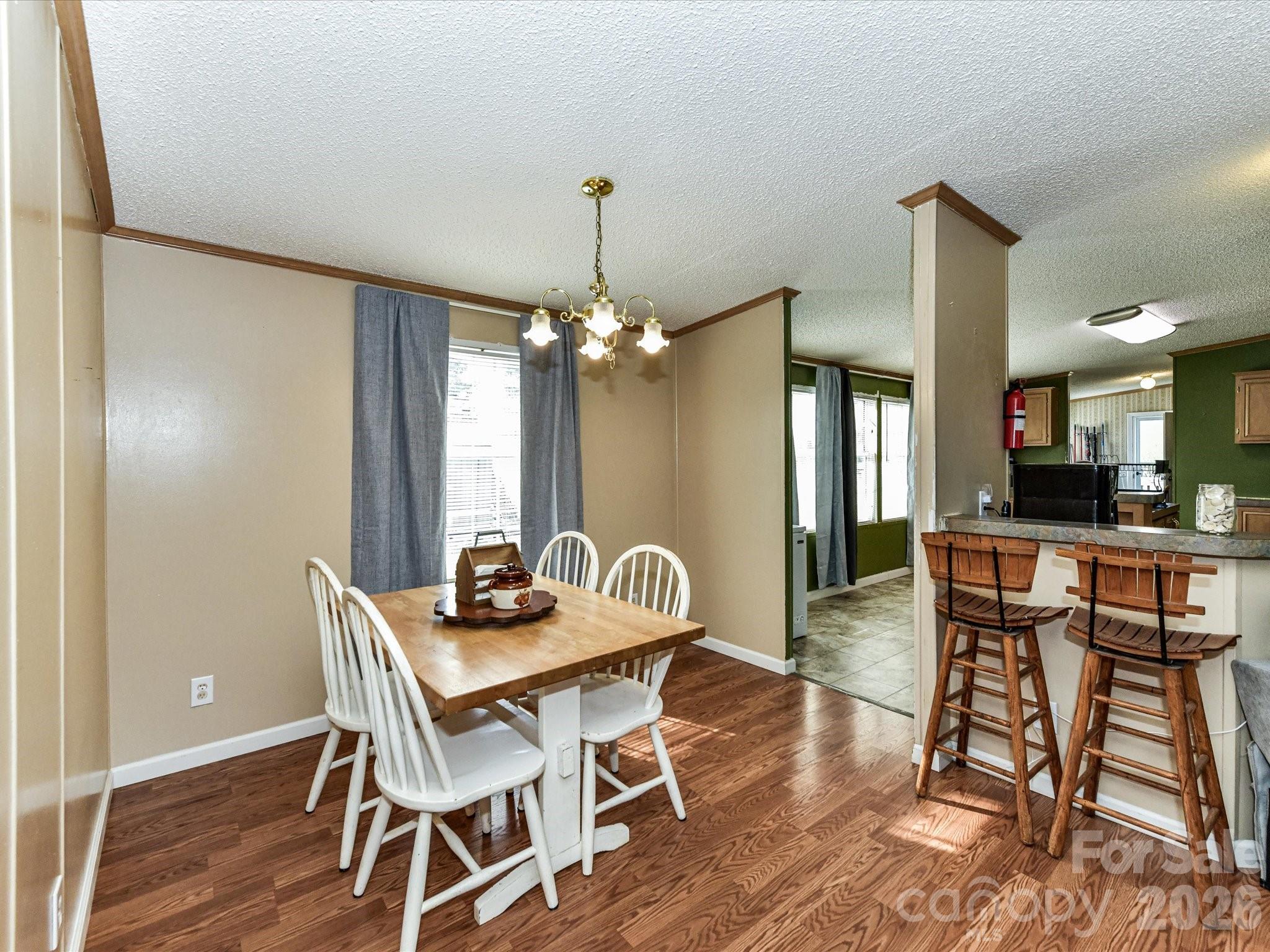 1565 Foxbrook Circle Lancaster, SC 29720 - Photo 9 of 28 a dining room with furniture window and wooden floor