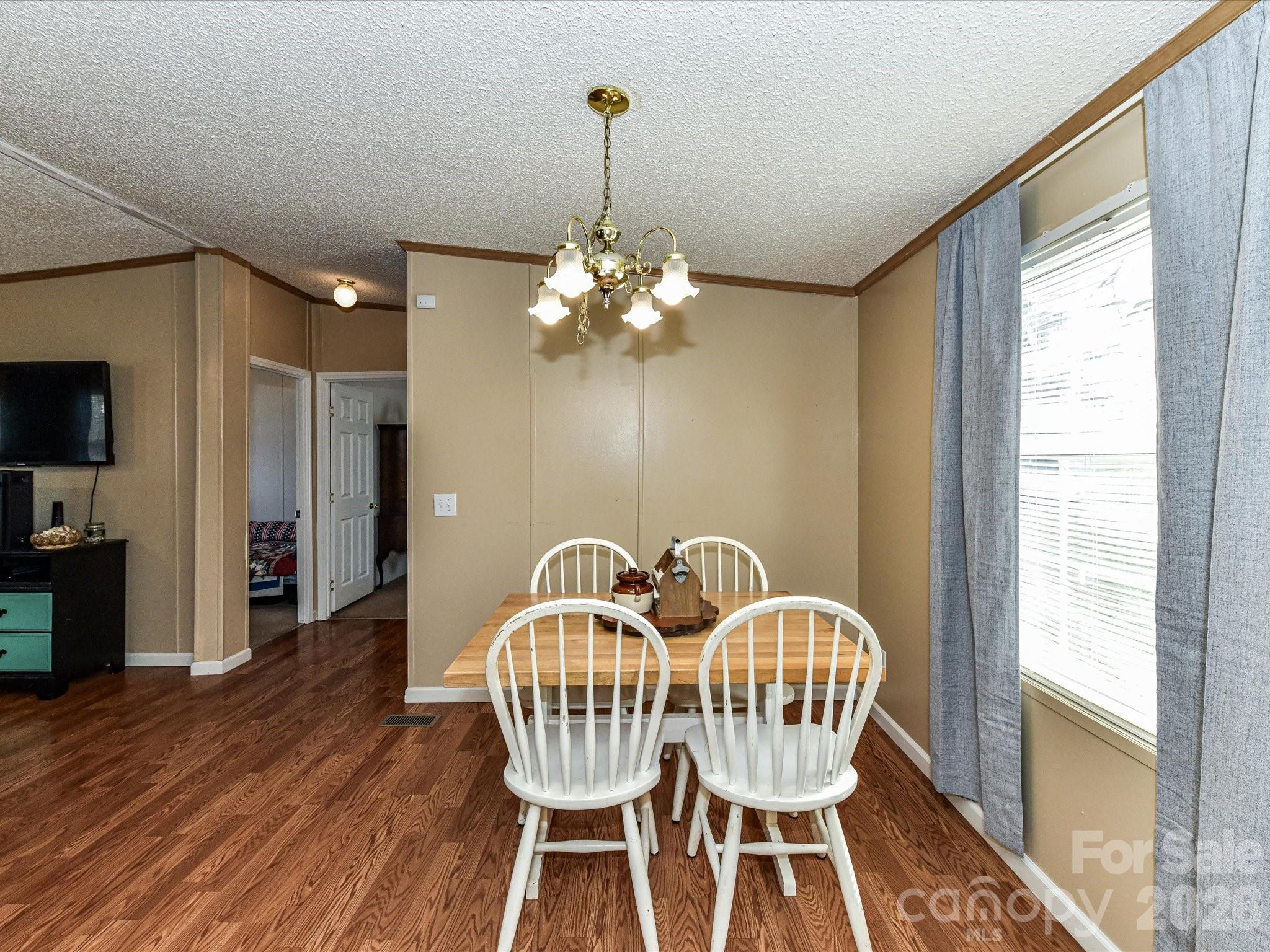 1565 Foxbrook Circle Lancaster, SC 29720 - Photo 10 of 28 a view of a dining room with furniture window and wooden floor