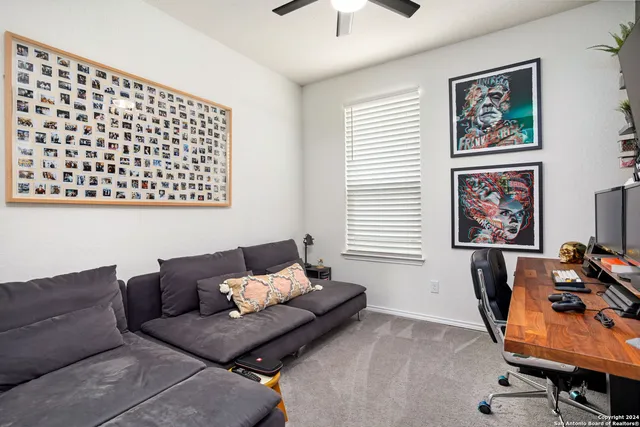 a living room with furniture and a window