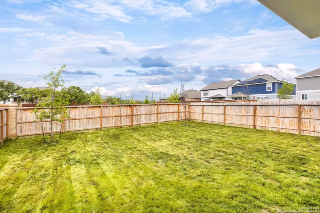 a view of ocean with a big yard