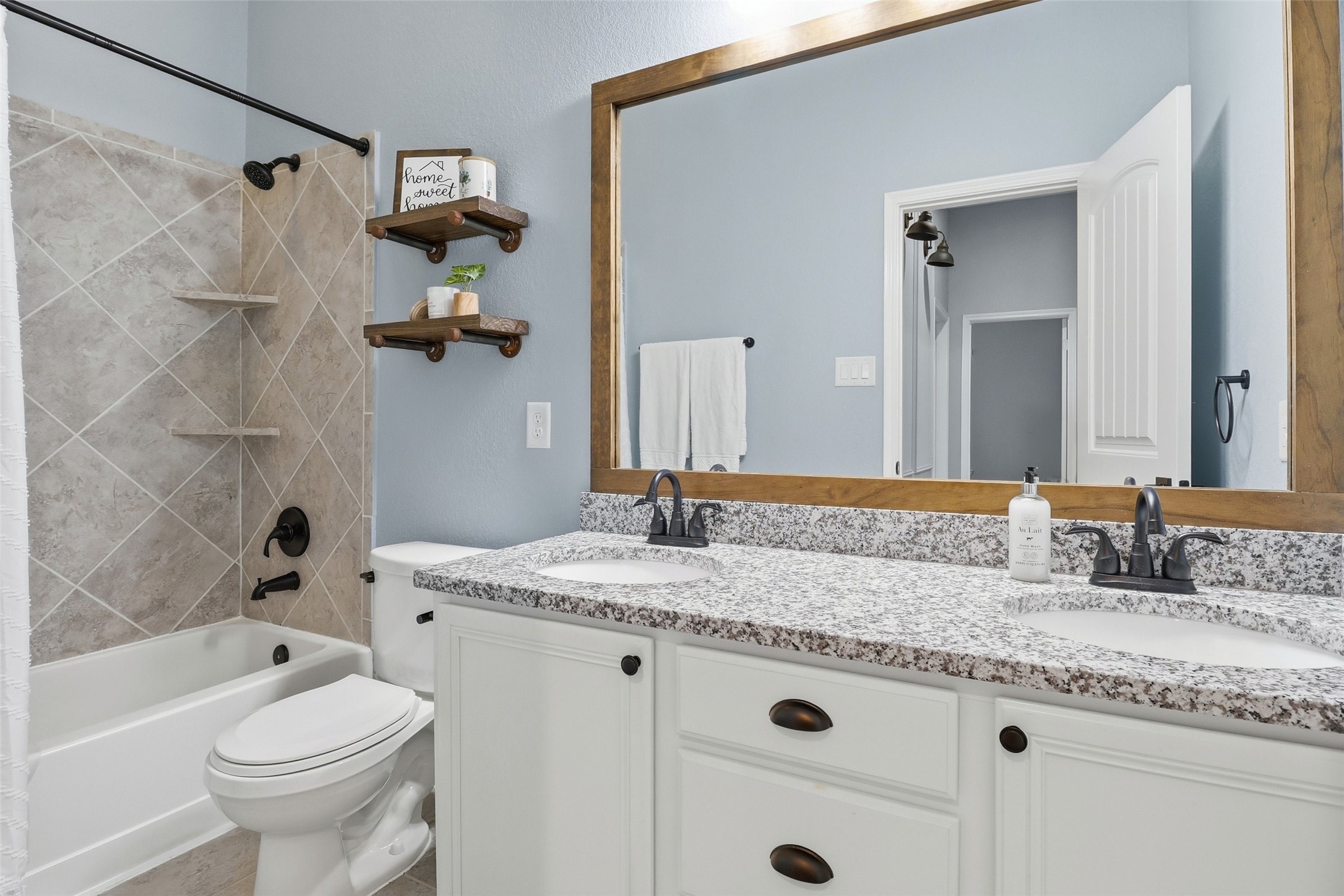 24126 Cane Fields Road Katy, TX 77493 - Photo 20 of 36 Primary suite and bathrooms feature updated plumbing fixtures, modern hardware, and added storage throughout.