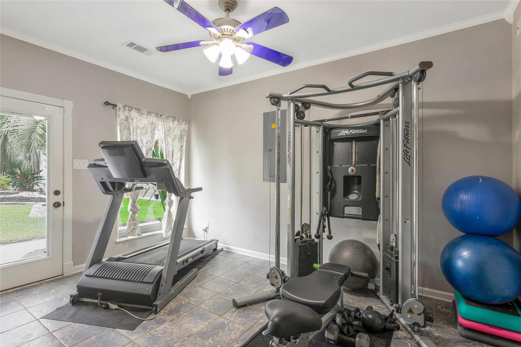 13914 Skinner Road Cypress, TX 77429 - Photo 42 of 50 Main House: Spacious flex room with recessed lighting, a ceiling fan, and direct outdoor access, ideal for a home gym, office, or additional living space.