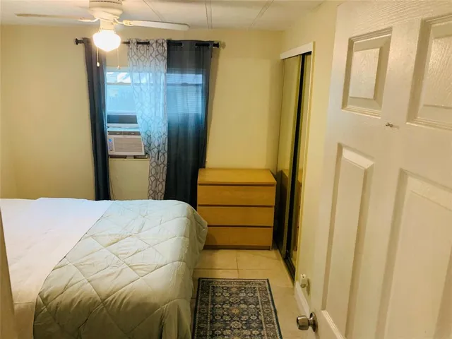 a bedroom with a bed and cabinets