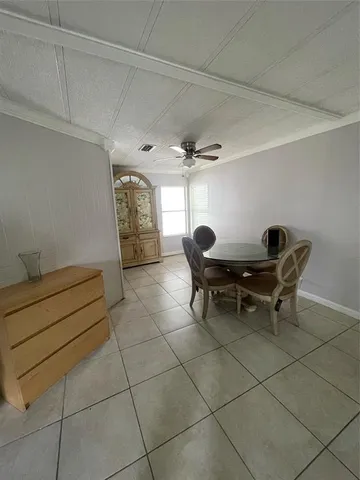 a work room with furniture and musical instruments