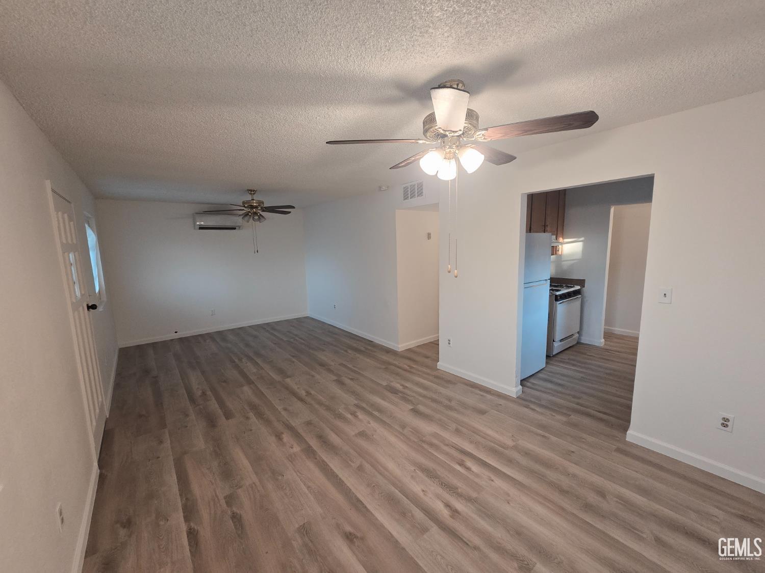 Undisclosed Address Wasco, CA 93280 - Photo 9 of 10 wooden floor in an empty room with a bathroom