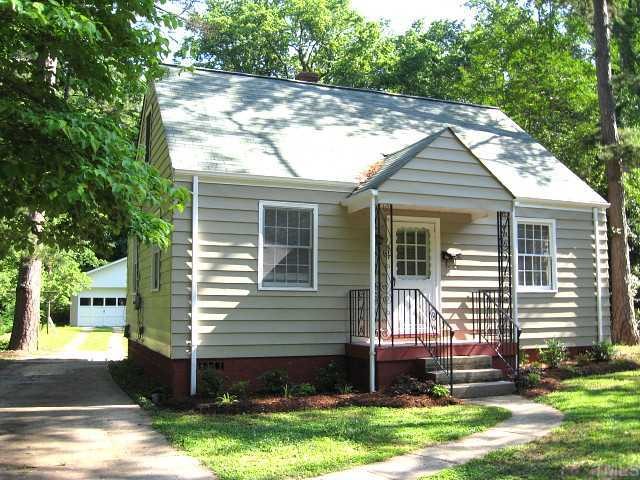 617 Edmund Street Raleigh, NC 27604 - Photo 1 of 12 a front view of a house with a yard