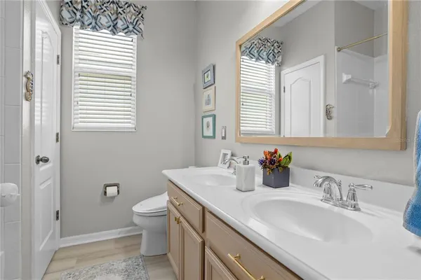 a bathroom with a glass shower door