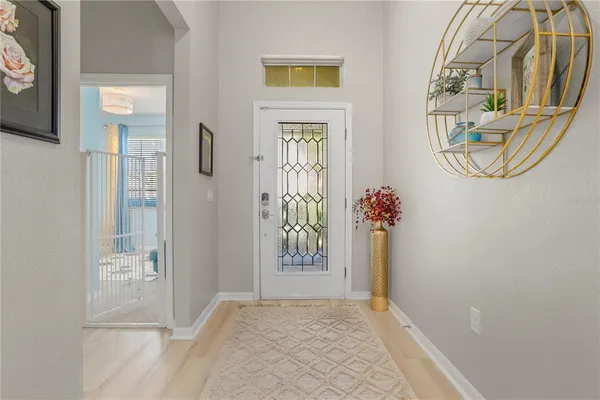 a living room with furniture and a book shelf
