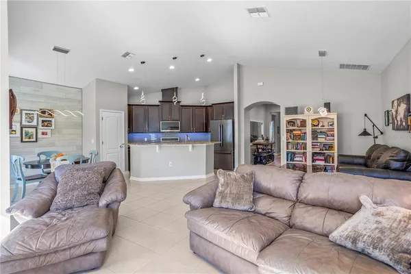 a view of a kitchen with cabinets and stainless steel appliances