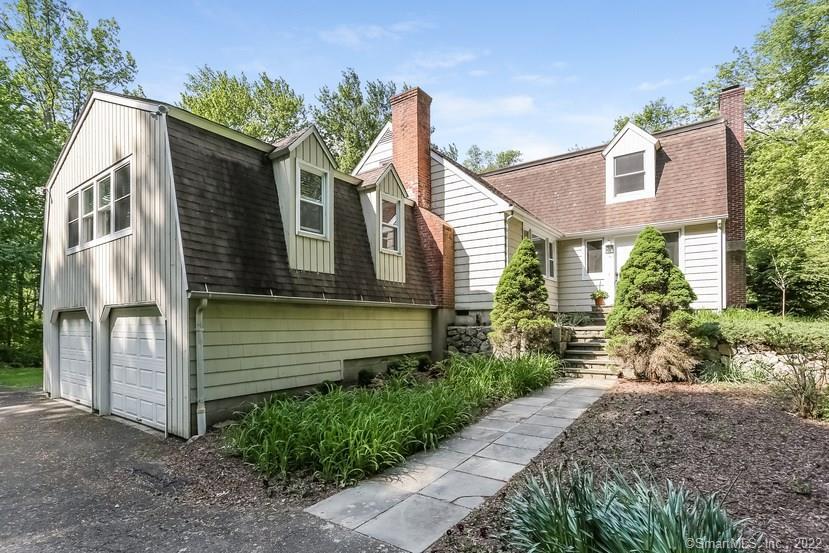16 Wilson Road Weston, CT 06883 - Photo 1 of 1 a front view of a house with a garden