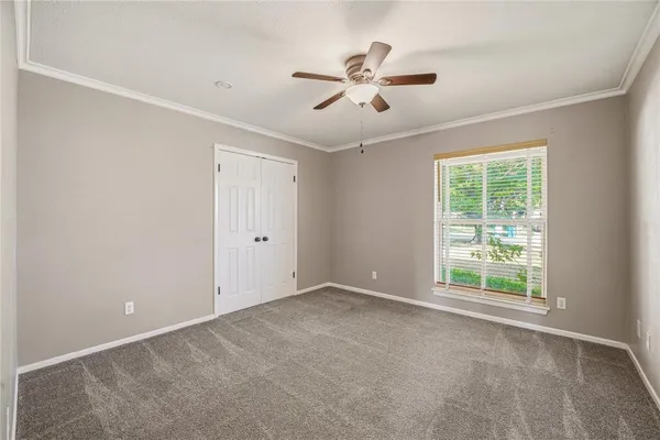 a view of an empty room with a window