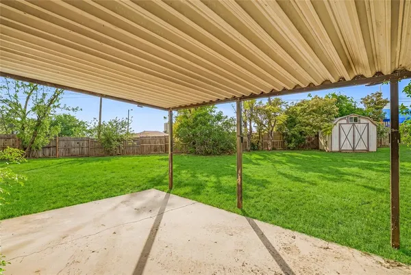 a view of a backyard with plants and garden