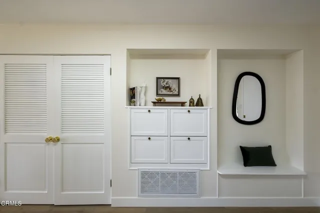 a kitchen with a refrigerator and a sink