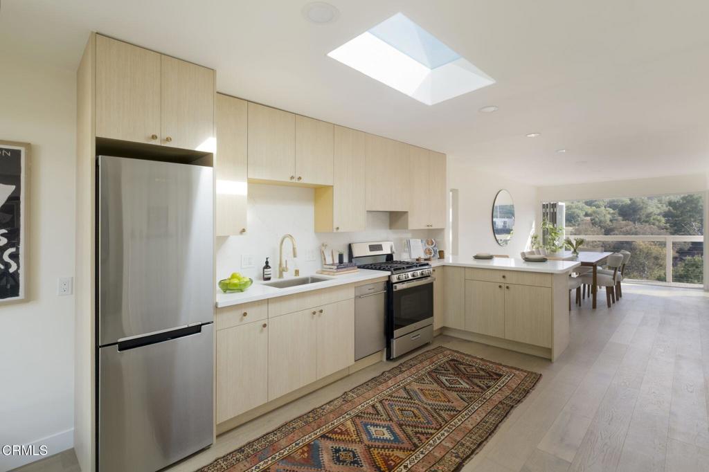 1158 Montecito Drive Los Angeles, CA 90031 - Photo 12 of 42 a kitchen with a refrigerator and a sink