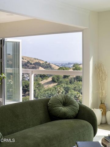 a view of a livingroom with furniture and a potted plant