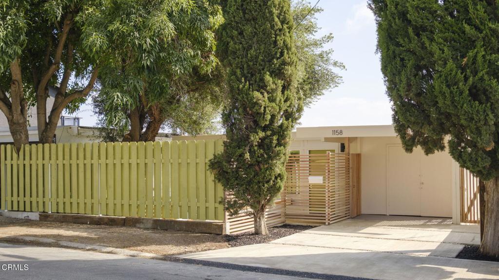 1158 Montecito Drive Los Angeles, CA 90031 - Photo 2 of 42 a front view of a house with a garden