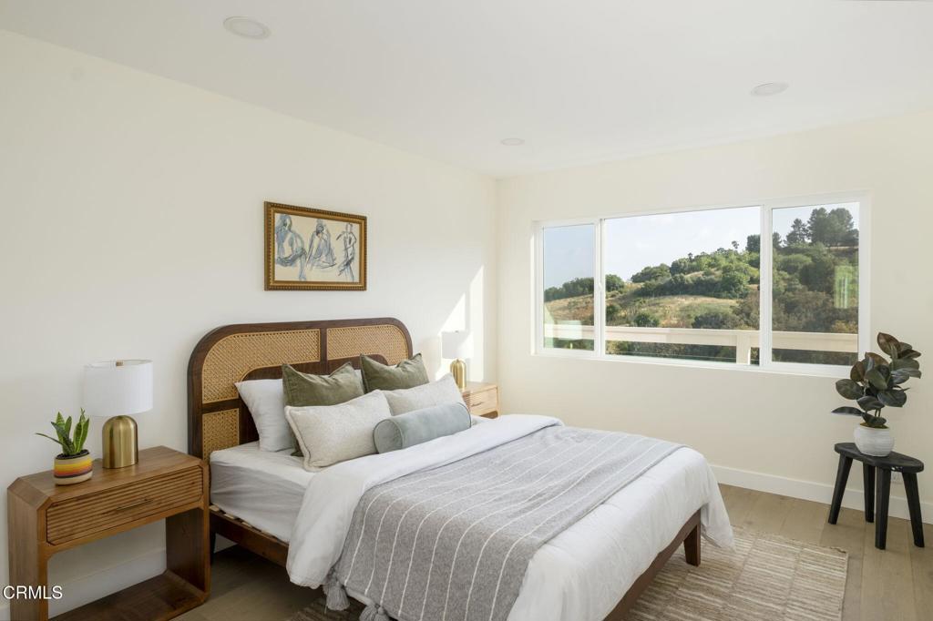 1158 Montecito Drive Los Angeles, CA 90031 - Photo 23 of 42 a bedroom with a bed and a large window