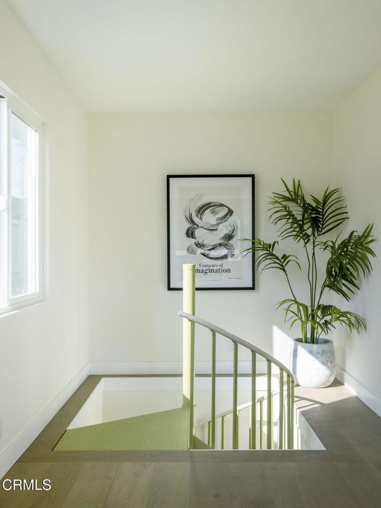 1158 Montecito Drive Los Angeles, CA 90031 - Photo 28 of 42 a view of a hallway with paintings on the wall