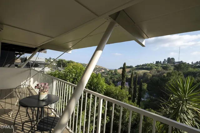 a view of a yard and mountain view