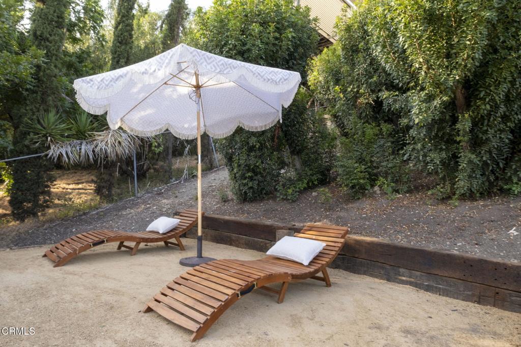 1158 Montecito Drive Los Angeles, CA 90031 - Photo 38 of 42 a backyard of a house with table and chairs