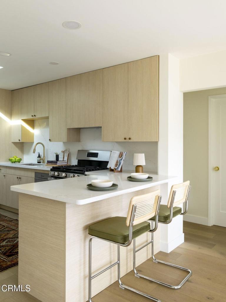 1158 Montecito Drive Los Angeles, CA 90031 - Photo 10 of 42 a kitchen with a sink and chairs
