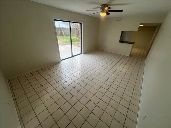 a view of an empty room and window