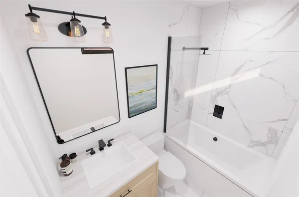 a bathroom with a sink a toilet and shower