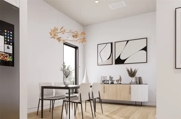 a view of hallway with furniture and a potted plant