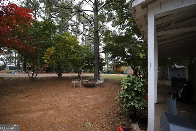 a view of a street with trees on both side of the road
